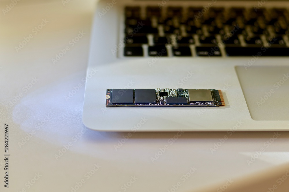 The SSD chip in the lower right of the laptop. Small parts of the