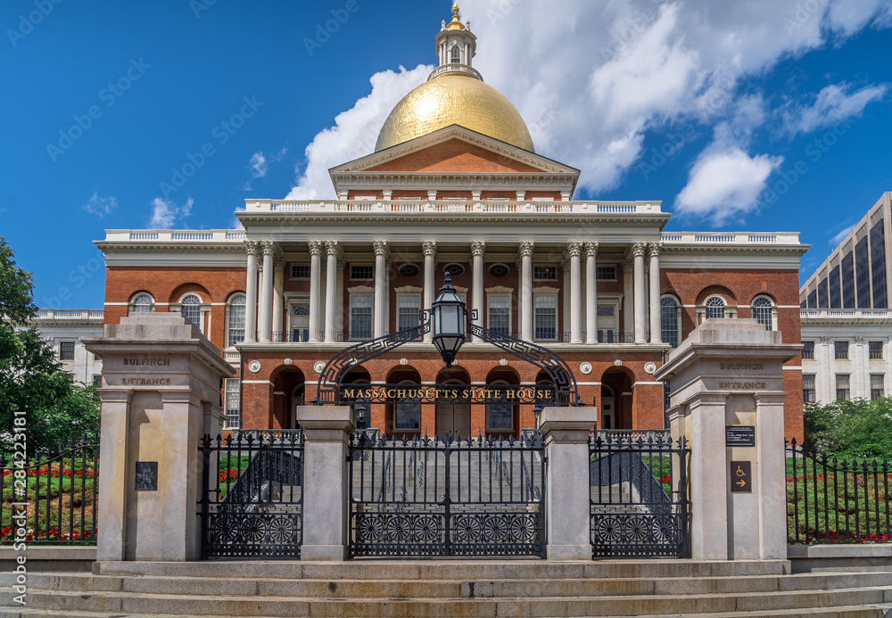 View of the Massachusetts State House with a golden dome in Boston on a sunny weekend summer afternoon