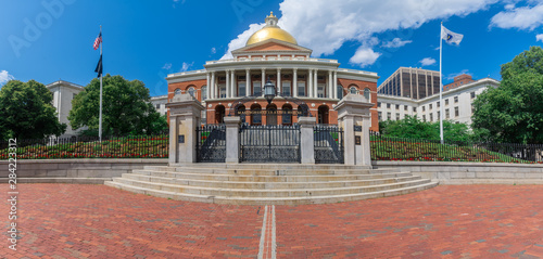 Photography View of the Massachusetts State House with a golden dome in Boston on a sunny we