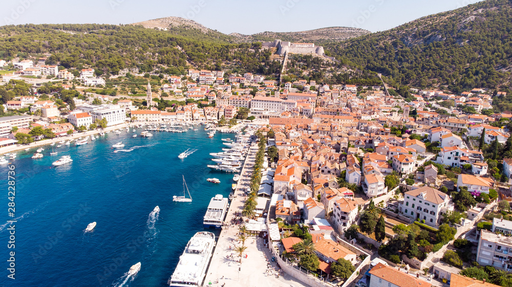 The Hvar harbour and the Tvrđava Fortica (Spanish fort) in Croatia from above
