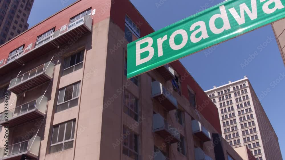 Broadway road sign generic to city buildings in background 4k Broadway road sign generic to city buildings in background 4k
