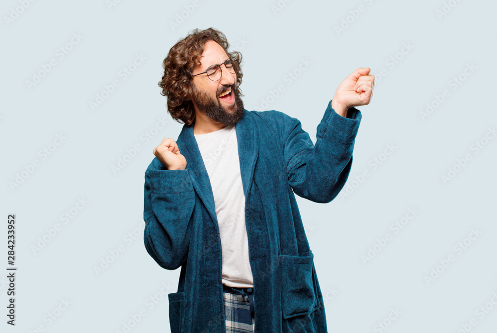 young man wearing bathrobe night suit dancing - obrazy, fototapety, plakaty 