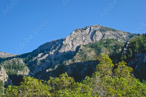 The mount Olympus rocky peak in the evening sunlight along the utah landscape. 