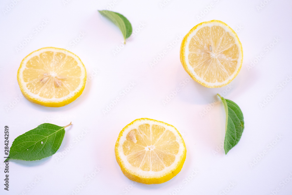 Creative layout made of lemon and leaves. Flat lay. Food concept. Lemon on white background