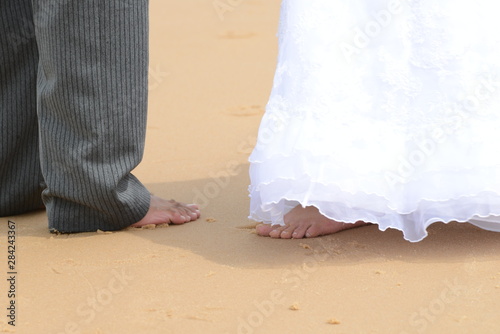 barefoot grooms on the beach