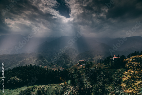 Sapa in Vietnam with paddy fields, terraces, valleys and Fansipan mountain during dramatic stormy weather in asia. © Andrew