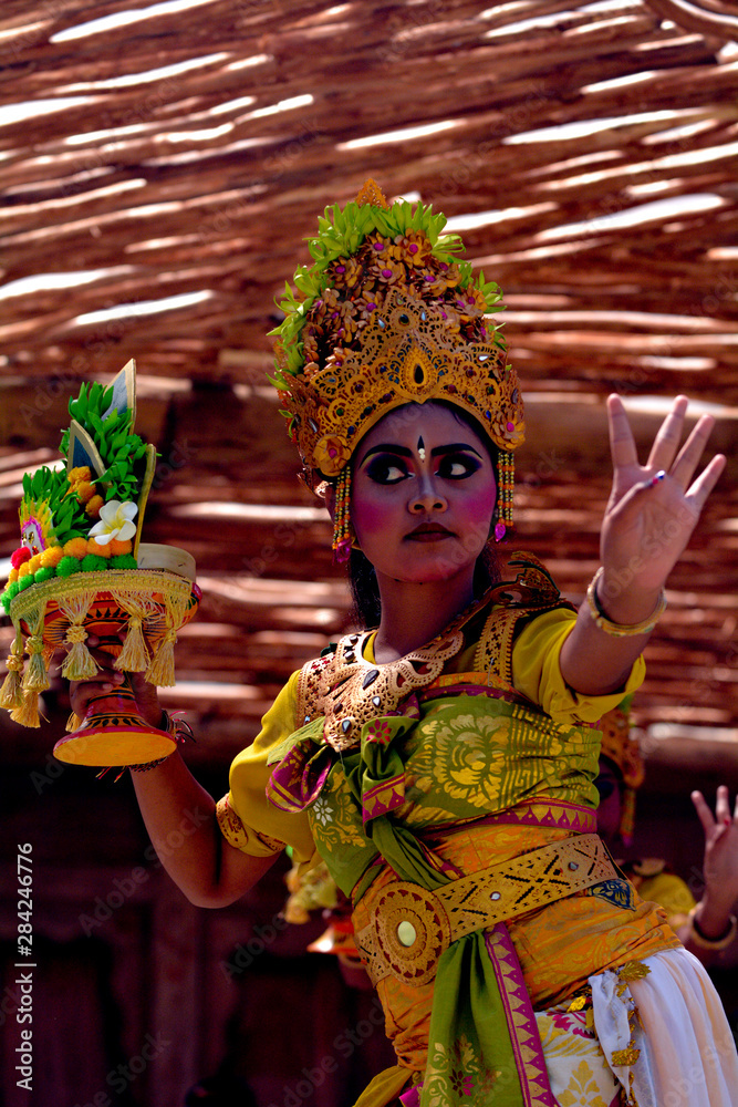 Balinese woman dancing Tari Pendet Dance in Bali Indonesia
