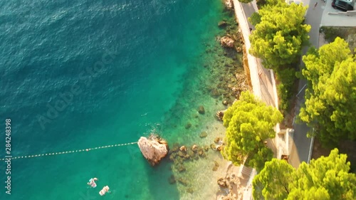 Bird eye view shot on the beautiful coastline of Punta Rata in Brela, Croatia photo