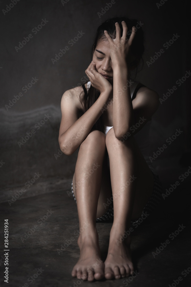 Depression or domestic violence Concept, Black and white image of a young woman crying and covering her face useful to illustrate stress. Depression or domestic violence Concept, Black and white image of a young woman crying and covering her face useful to illustrate stress.