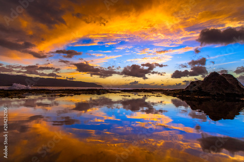 Amazing North Shore Oahu sunset reflected in a tide pool © shanemyersphoto