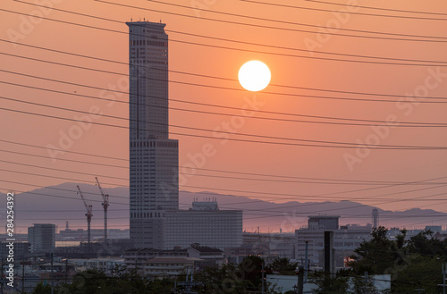 Izumisano, Japan - July 25, 2019: Sunset over Rinku Gate Tower, the second tallest building in Osaka photo