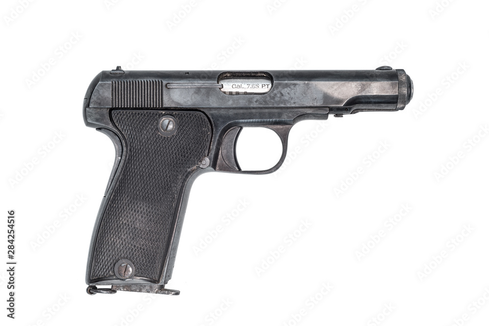 side view of an old automatic pistol caliber 7.65, isolated on white background. side view of an old automatic pistol caliber 7.65, isolated on white background.