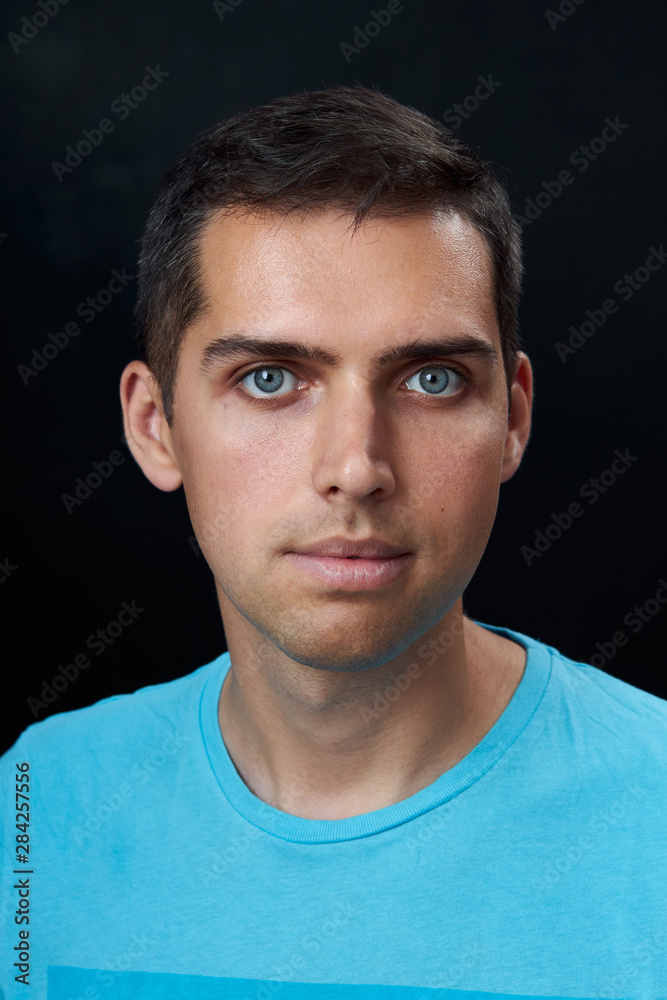 Fototapeta premium portrait of young man on black background