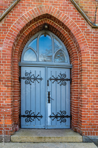 old wooden church door with hinges © Normunds