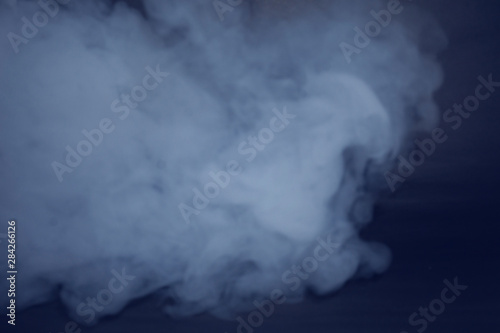 Abstract smoke steam moves on a black background . The concept of aromatherapy.