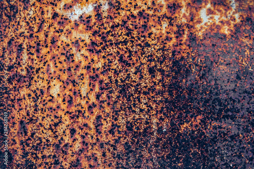 Rusty metal surface with blue paint residue as background image © Andriy