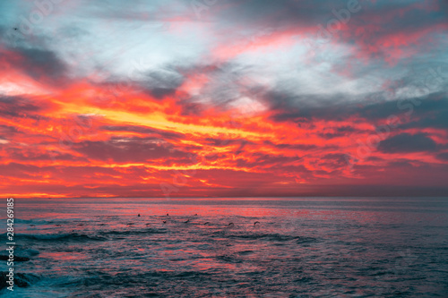 Fototapeta Naklejka Na Ścianę i Meble -  Beautiful sunset with clouds lit by sun on sea