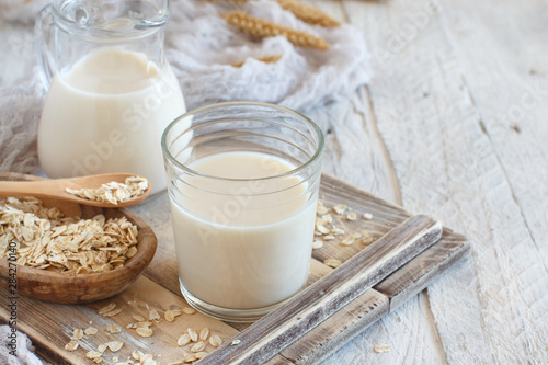 Fototapeta Vegan oat milk, non dairy alternative milk