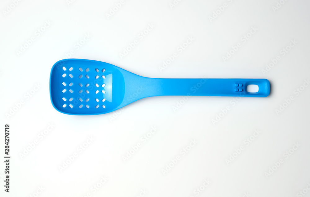 blue plastic spoon with holes for mixing salad blue plastic spoon with holes for mixing salad