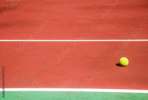 tennis ball on the court © Sergey