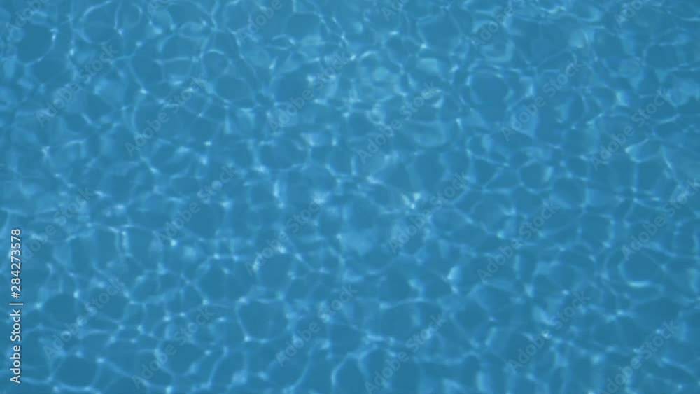 Blue water of a swimming pool with waves, beautiful background Blue water of a swimming pool with waves, beautiful background