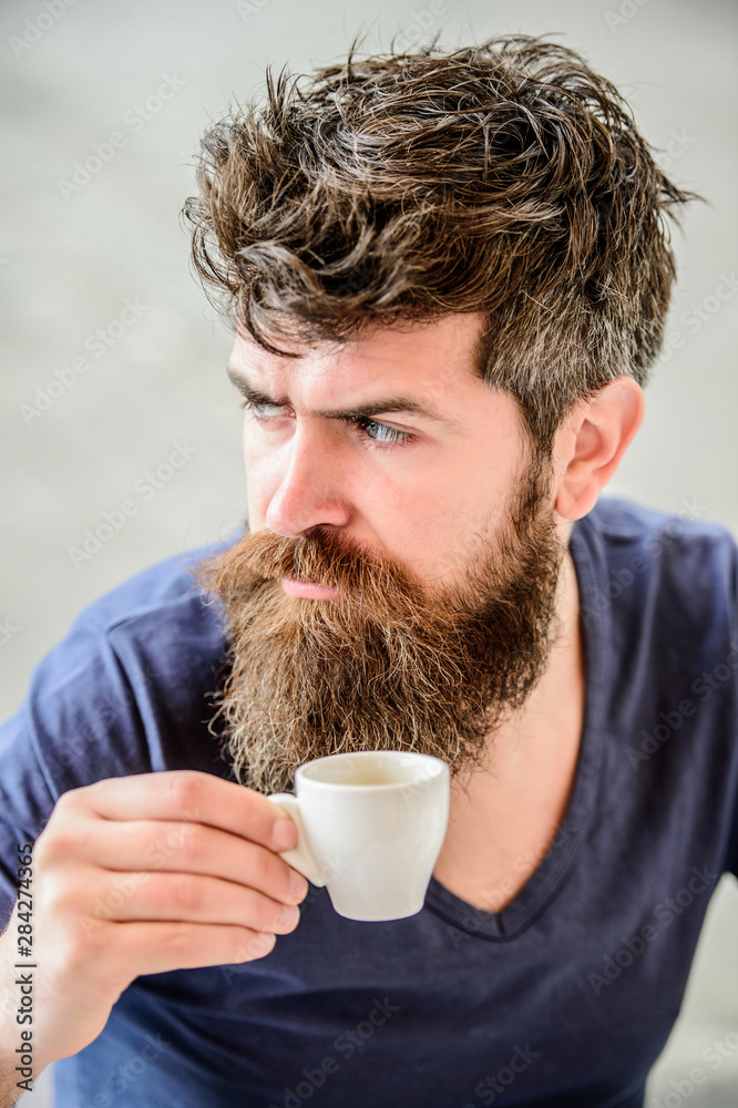 Enjoy hot drink. Hipster drinking fresh brewed coffee. Man with beard and mustache and espresso cup. Bearded guy consume caffeine. Espresso arabica only. Coffee break concept. Guy relaxing espresso Enjoy hot drink. Hipster drinking fresh brewed coffee. Man with beard and mustache and espresso cup. Bearded guy consume caffeine. Espresso arabica only. Coffee break concept. Guy relaxing espresso
