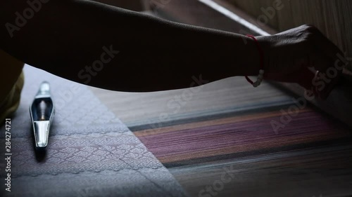 weave silk cotton on the manual wood loom ,Thailand,selective focus,vintage color photo