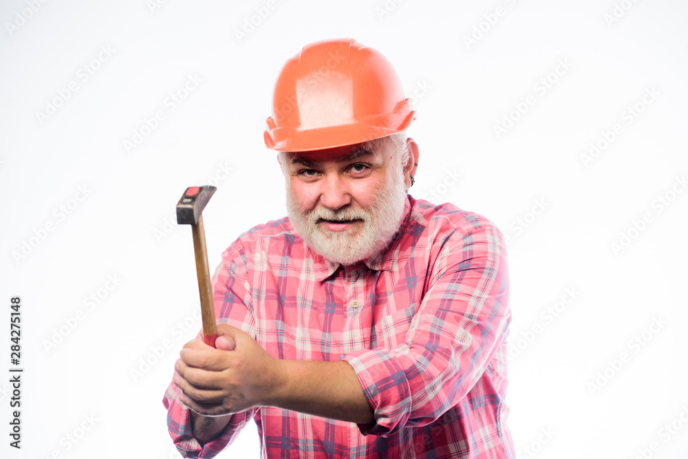 Repair workshop. Repair concept. Senior foreman worker. Home improvement repair. Man bearded laborer wear helmet hold hammer. Handyman home repair. Experienced engineer. Repairing or renovating