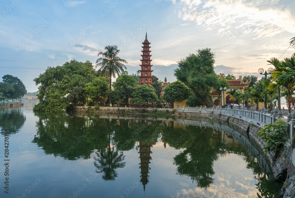 Tran Quoc pagoda during sunset time, the oldest temple in Hanoi, Vietnam. Hanoi cityscape. Tran Quoc pagoda during sunset time, the oldest temple in Hanoi, Vietnam. Hanoi cityscape.