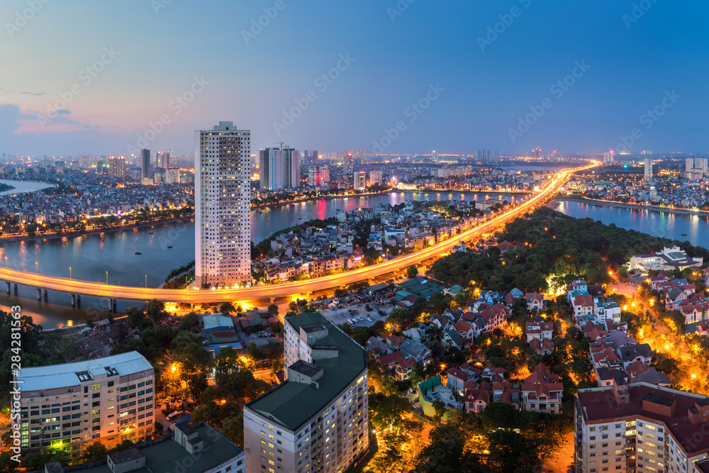 Aerial skyline view of Hanoi at Linh Dam lake, Belt Road No. 3. Hanoi cityscape by sunset period