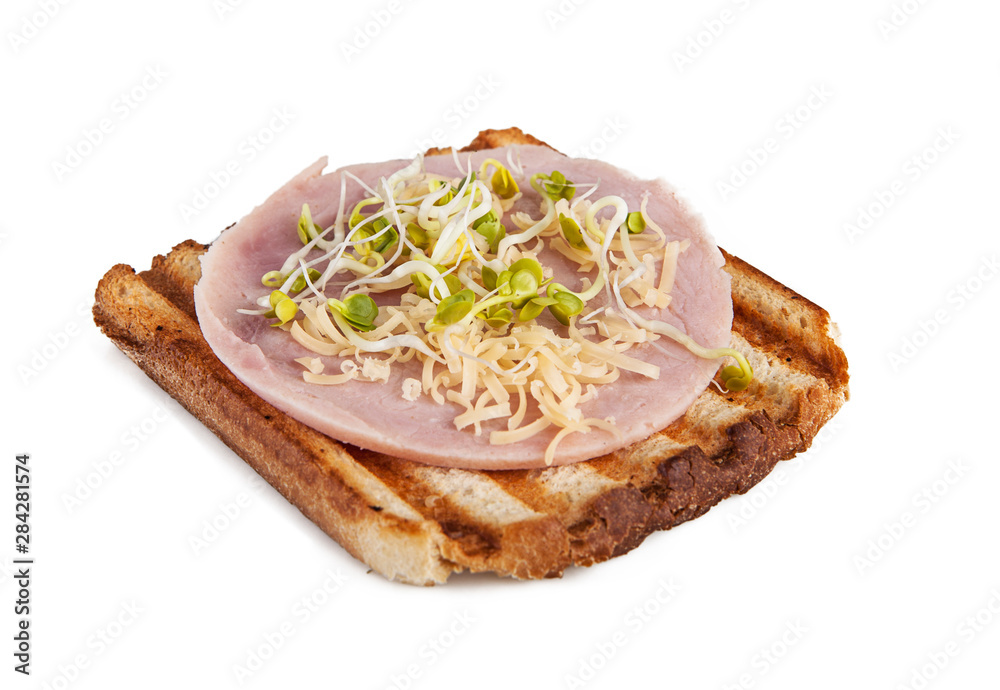 Toast with ham and sprouts on a white background (view from a different angle in the portfolio) Toast with ham and sprouts on a white background (view from a different angle in the portfolio)