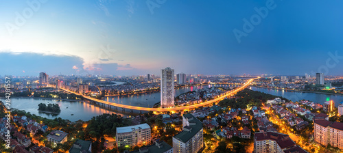 Aerial skyline view of Hanoi at Linh Dam lake, Belt Road No. 3. Hanoi cityscape by sunset period photo