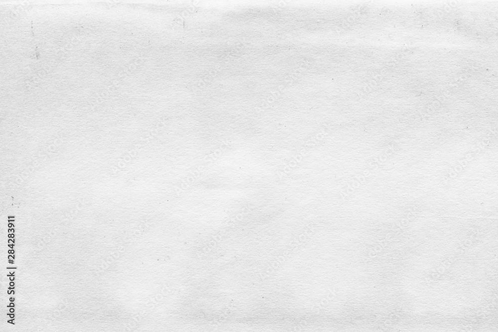 Fototapeta premium Cardboard white texture close-up. Light old paper background. Grunge concrete wall. Vintage blank wallpaper.