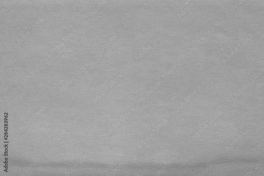 Naklejka premium Cardboard white texture close-up. Light old paper background. Grunge concrete wall. Vintage blank wallpaper.