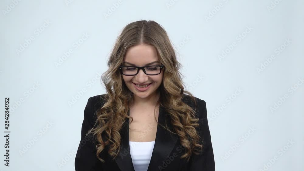 Hesitated woman holding two marshamallow and wants to eat it on gray background, slow motion Hesitated woman holding two marshamallow and wants to eat it on gray background, slow motion