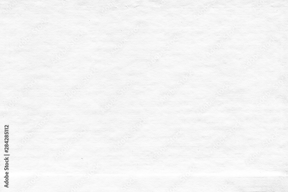 Fototapeta premium Cardboard white texture close-up. Light old paper background. Grunge concrete wall. Vintage blank wallpaper.