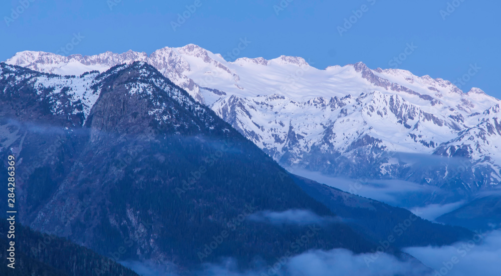 Maladetas peaks and foggy valley