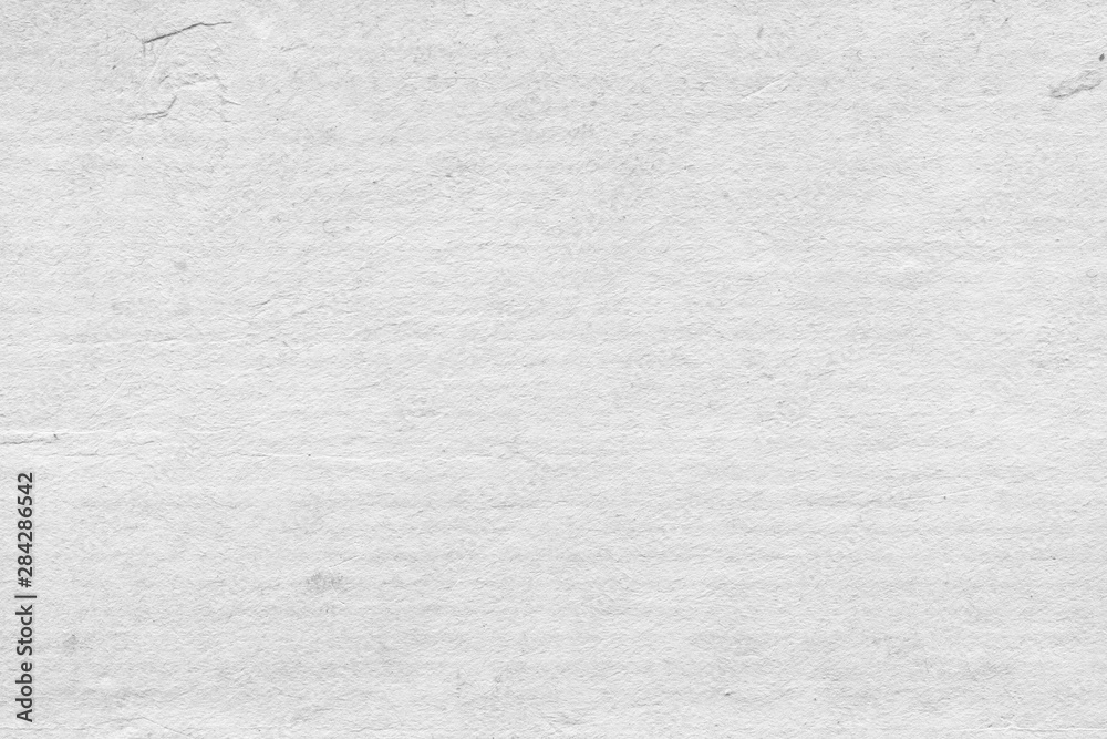 Fototapeta premium Cardboard white texture close-up. Light old paper background. Grunge concrete wall. Vintage blank wallpaper.