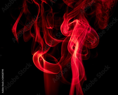 Red smoke on black background