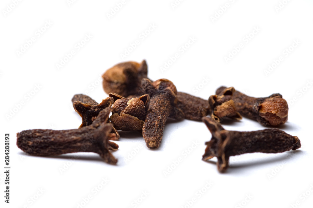 dried cloves on a white background. Close-up photo.