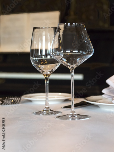 Empty wine glasses are served on the table, vertical orientation