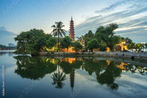 Tran Quoc pagoda during sunset time, the oldest temple in Hanoi, Vietnam. Hanoi cityscape.