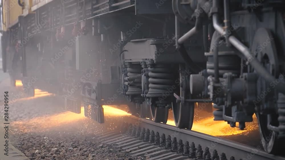 from under the car of a train sparks