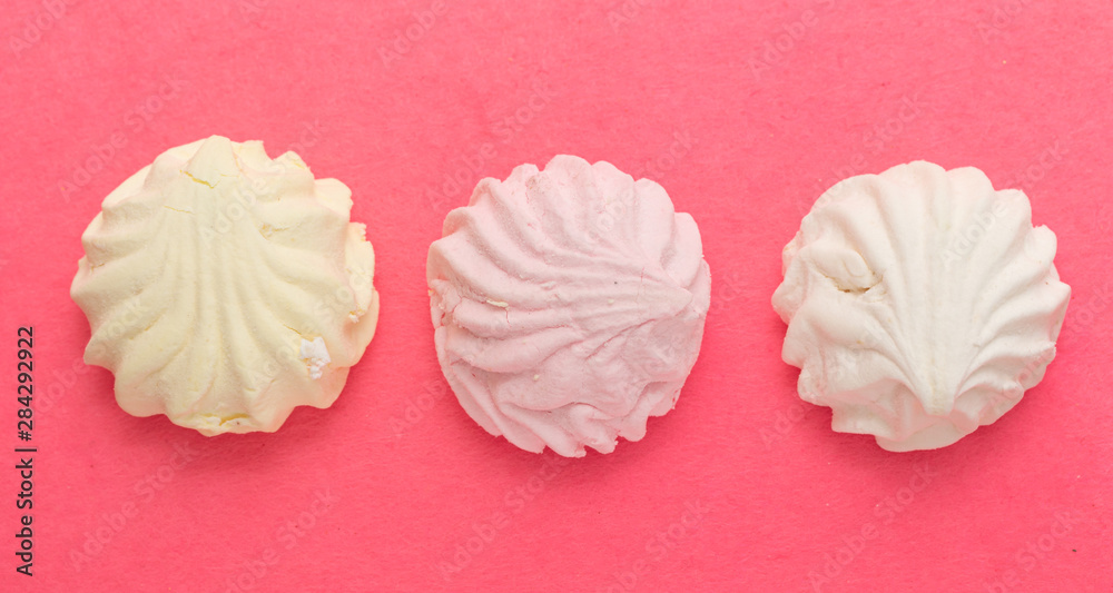 Marshmallow round sweet food on a pink background. Marshmallow round sweet food on a pink background.