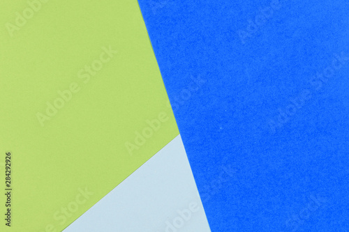 Paper empty blue, yellow, pastel background, geometrically located. Color blank for presentations, copy space.