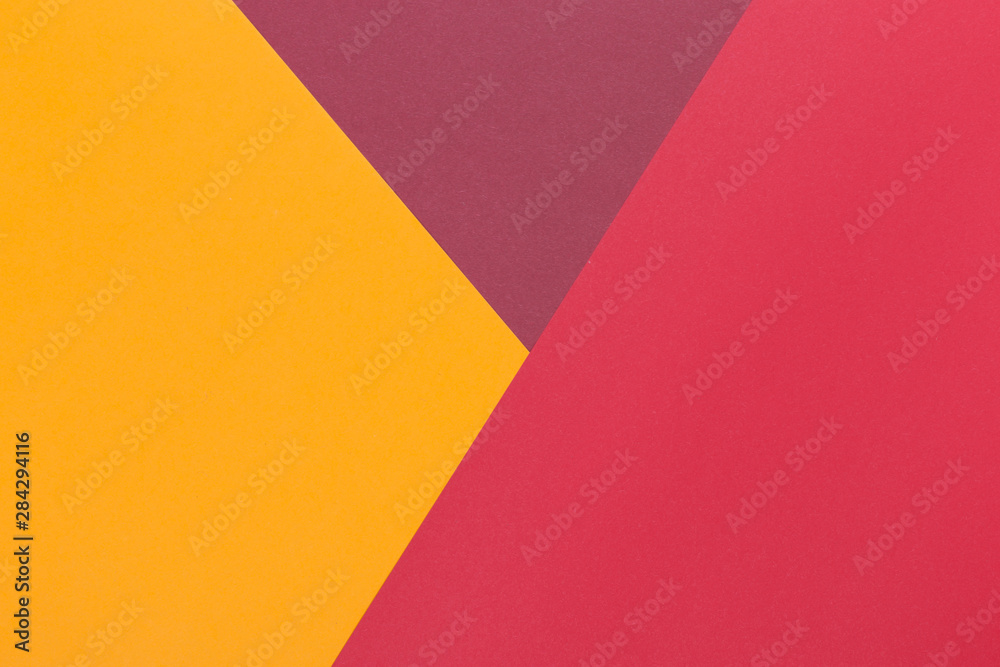 Paper yellow, burgundy, red empty background, geometrically located. Color blank for presentations, copy space.