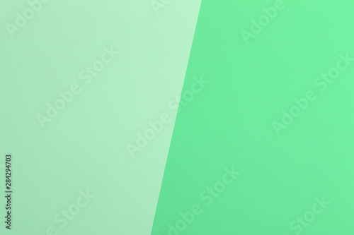Paper blue, green empty background, geometrically located. Color blank for presentations, copy space.
