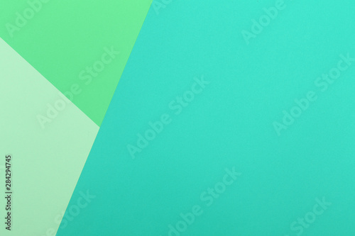 Paper blue, green empty background, geometrically located. Color blank for presentations, copy space.