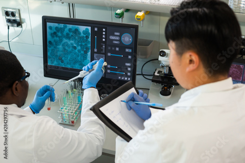 Photos Scientist and students working in lab