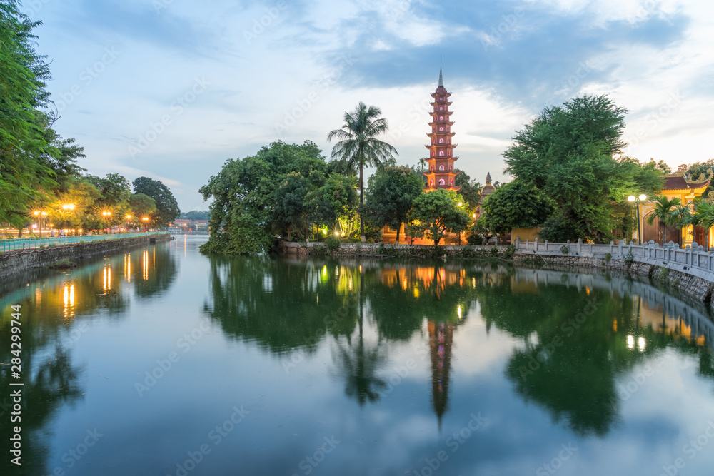 Tran Quoc pagoda during sunset time, the oldest temple in Hanoi, Vietnam. Hanoi cityscape. Tran Quoc pagoda during sunset time, the oldest temple in Hanoi, Vietnam. Hanoi cityscape.